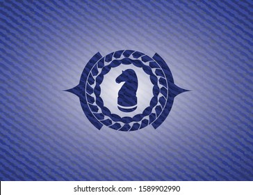 chess knight icon inside badge with jean texture
