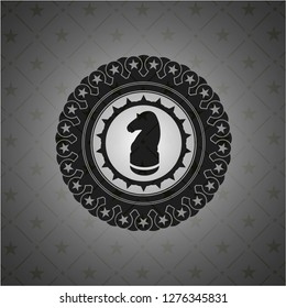 chess knight icon inside black emblem