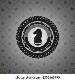 chess knight icon inside black badge