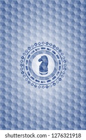 chess knight icon inside blue badge with geometric pattern.