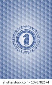 chess knight icon inside blue hexagon emblem.