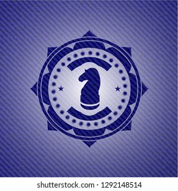 chess knight icon inside denim background