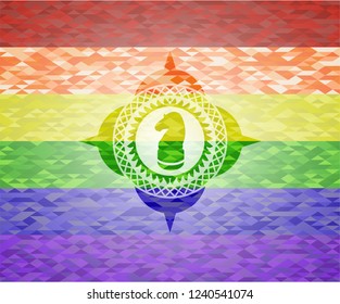 chess knight icon inside emblem on mosaic background with the colors of the LGBT flag