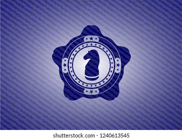 chess knight icon inside emblem with jean background
