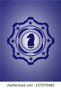 chess knight icon inside emblem with jean texture