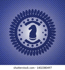 chess knight icon inside emblem with jean background