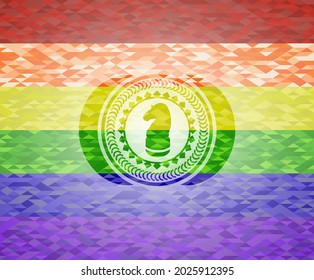 chess knight icon inside emblem on mosaic background with the colors of the LGBT flag. 