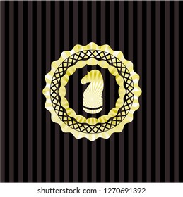 chess knight icon inside gold emblem