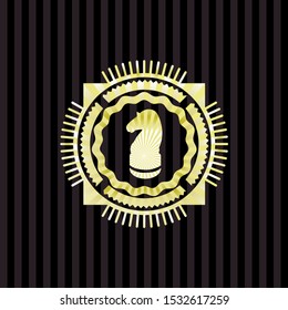 chess knight icon inside gold emblem