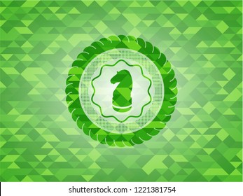 chess knight icon inside green emblem with mosaic background