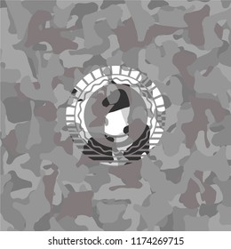 chess knight icon inside grey camouflage texture