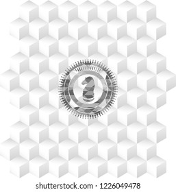 chess knight icon inside grey badge with geometric cube white background