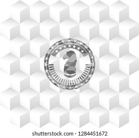 chess knight icon inside grey emblem with cube white background