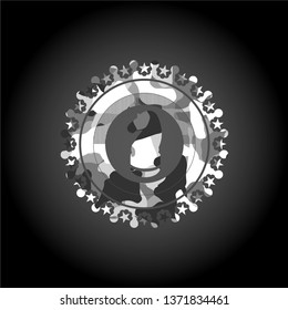 chess knight icon inside grey camo emblem