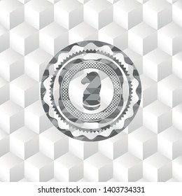 chess knight icon inside grey emblem with geometric cube white background