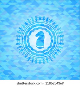 chess knight icon inside light blue emblem with mosaic background
