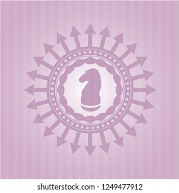 chess knight icon inside pink emblem