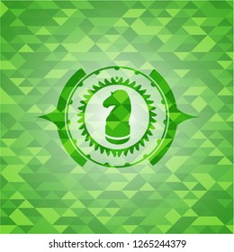 chess knight icon inside realistic green mosaic emblem
