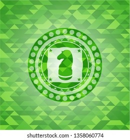chess knight icon inside realistic green mosaic emblem