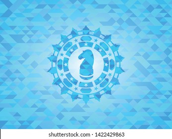 chess knight icon inside realistic light blue mosaic emblem