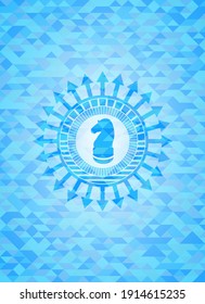 chess knight icon inside realistic light blue emblem. Mosaic background. 