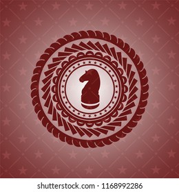 chess knight icon inside red emblem