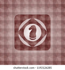 chess knight icon inside red seamless emblem or badge with geometric pattern background.