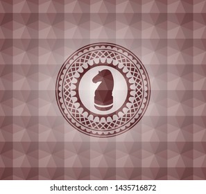 chess knight icon inside red seamless geometric badge.