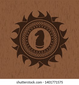chess knight icon inside retro wood emblem