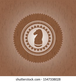 chess knight icon inside retro wood emblem