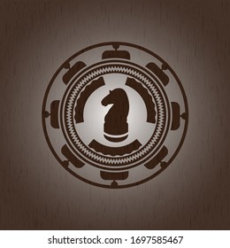 chess knight icon inside retro wooden emblem
