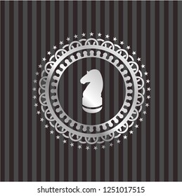 chess knight icon inside silver emblem