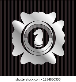 chess knight icon inside silver shiny emblem