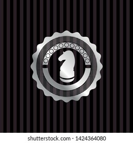 chess knight icon inside silver badge