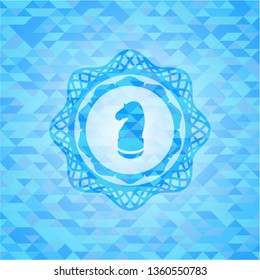chess knight icon inside sky blue emblem. Mosaic background