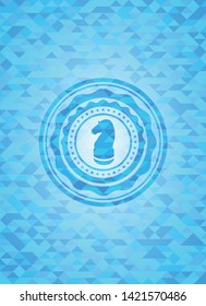 chess knight icon inside sky blue mosaic emblem