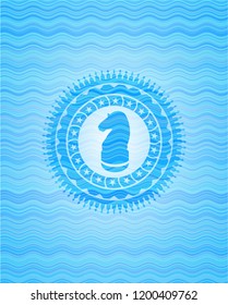 chess knight icon inside water concept badge.