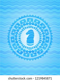 chess knight icon inside water wave style emblem.