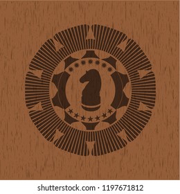chess knight icon inside wood badge or emblem