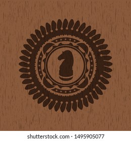 chess knight icon inside wood badge or emblem