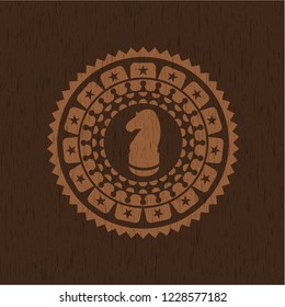 chess knight icon inside wooden emblem. Vintage.