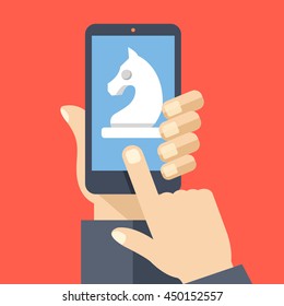 Chess knight on smartphone screen. Hand holds smartphone, finger touches screen. Modern business strategy concept for web banners, websites, infographics. Creative flat design vector illustration