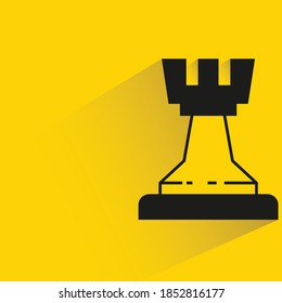 chess with shadow on yellow background