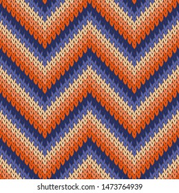 Chevron knitted seamless pattern vector design. Red blue colors winter jumper knitwear fabric print. Norwegian knitted seamless sweater pattern in traditional christmas style.