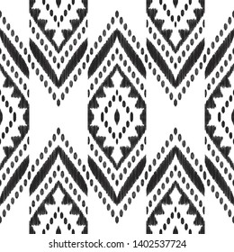 Chevron seamless pattern. Black and white textured background. Ethnic Ikat print. Vector illustration in modern aztec, navajo, boho style. Usable for textile, wallpaper,