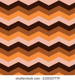 Chevron zigzag seamless pattern in brown, orange and cream. Retro 70s style pattern,  great for wallpaper, textile and home décor  