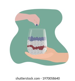 Chia pupping with blueberries. Mother's hand holding glass with pudding. Child's hand holding berry. Healthy food