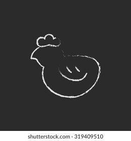 Chick hand drawn in chalk on a blackboard vector white icon isolated on a black background.