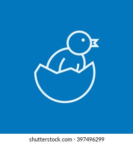 Chick peeking out of egg shell line icon.