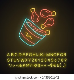 Chicken bucket neon light icon. BBQ chicken drumsticks, legs. Unhealthy fast food. Cafe, steakhouse menu. Meat cookery. Glowing sign with alphabet, numbers and symbols. Vector isolated illustration